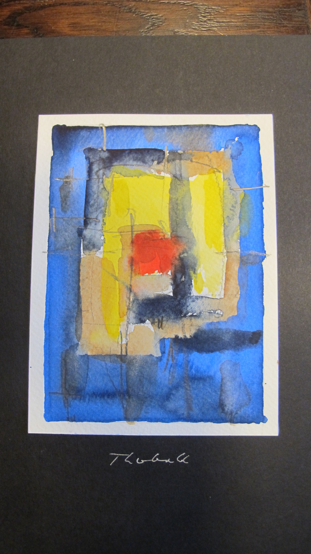 Werk von Günther Theobald in der Ausstellung im Goldenen Engel in Baumholder. Es ist ein abstraktes Bild in den Farben Blau, Gelb. Orangerot