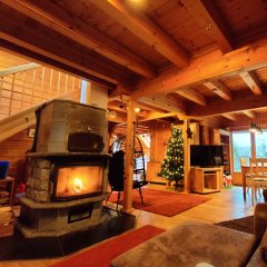 Ferienhaus Blockhaus in Eckersweiler - Wohnbereich mit Kamin Ferienhaus Blockhaus in Eckersweiler - Wohnbereich mit Kamin